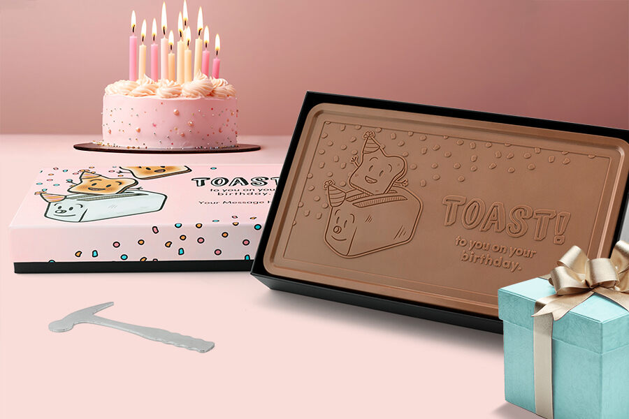Chocolate bar next to birthday cake and gift box. Unique Chocolate Gift Ideas for Every Occasion