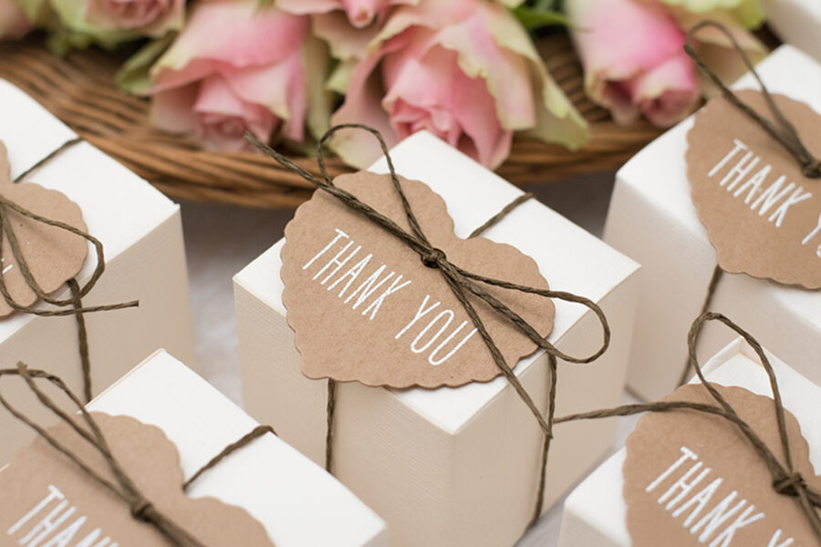 Wedding favors featuring chocolate treats with elegant thank you tags for guests