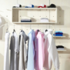 A clothing rack displaying promotional shirts and hats, showcasing various styles and colors for potential customers