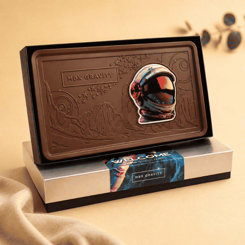 Custom engraved chocolate gift featuring a space-themed design with personalized packaging